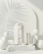 AMINI STRIA Book Holder in White — studio shot with arch backdrop and white spheres