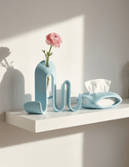 AMINI STRIA Entry Set in Baby Blue — book holder and tissue holder on a white shelf with a pink ranunculus