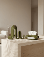 AMINI STRIA Entry Set in Olive — book holder and tissue holder on a stone coffee table in a neutral living room