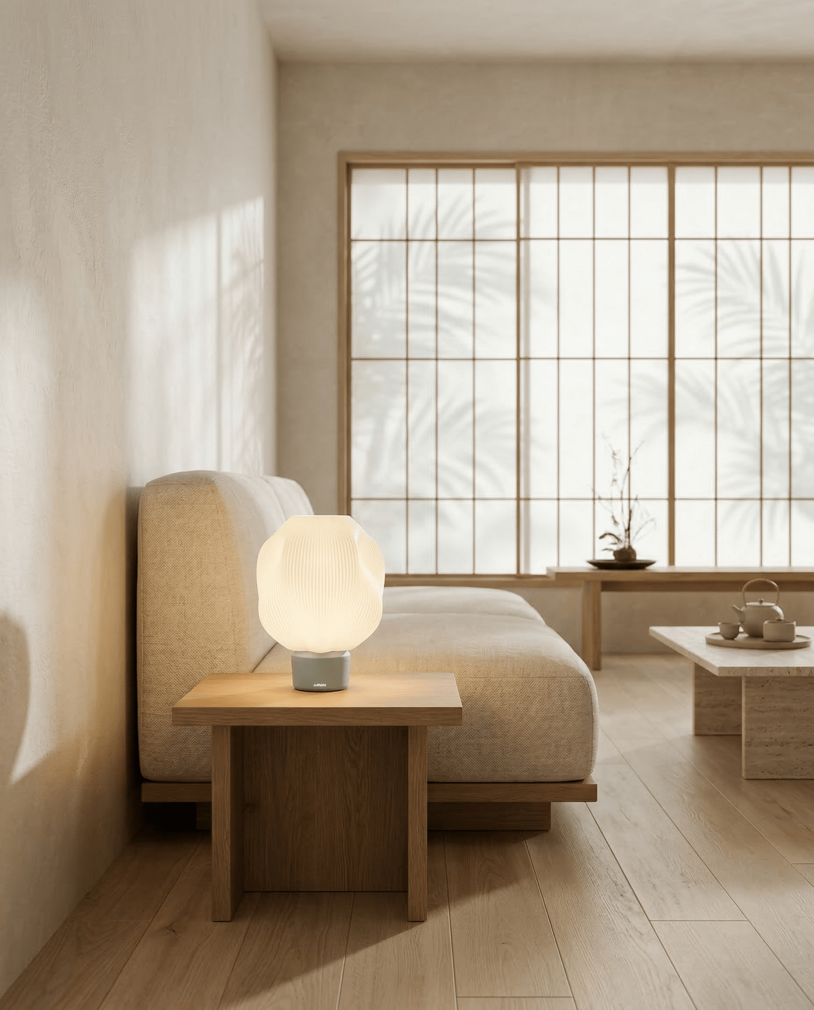 AMINI STRIA Lamp in Cream — on a bedside table in a Japanese-inspired bedroom with palm shadow on shoji screens