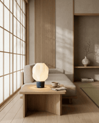 AMINI STRIA Lamp in Charcoal — on a low coffee table in a Japanese room with a cup of tea and wood slat wall