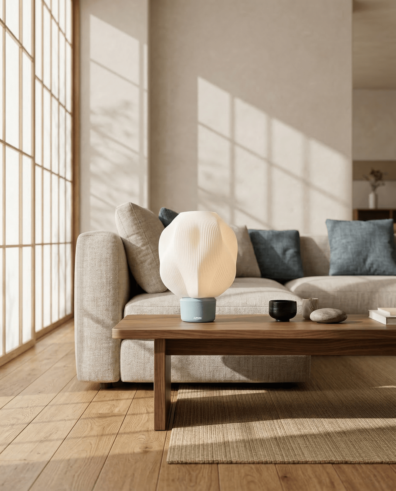 AMINI STRIA Lamp in Baby Blue — on a walnut coffee table in a living room with blue cushion sofa