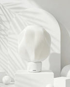 AMINI STRIA Lamp in White — studio shot with arch backdrop and white spheres