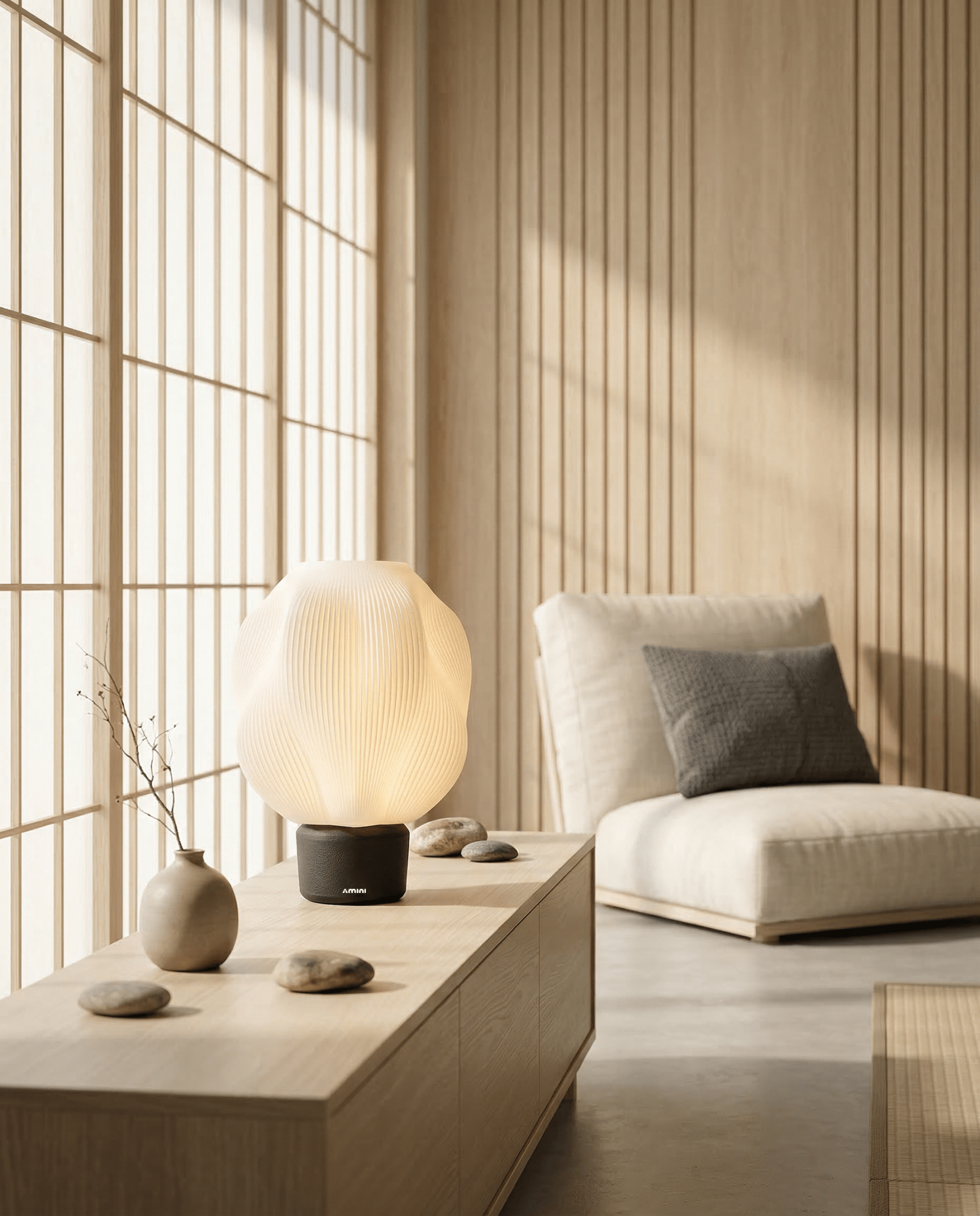 AMINI STRIA Lamp in Charcoal — on a low wood surface in a Japanese room with wood slat wall, stones and vase