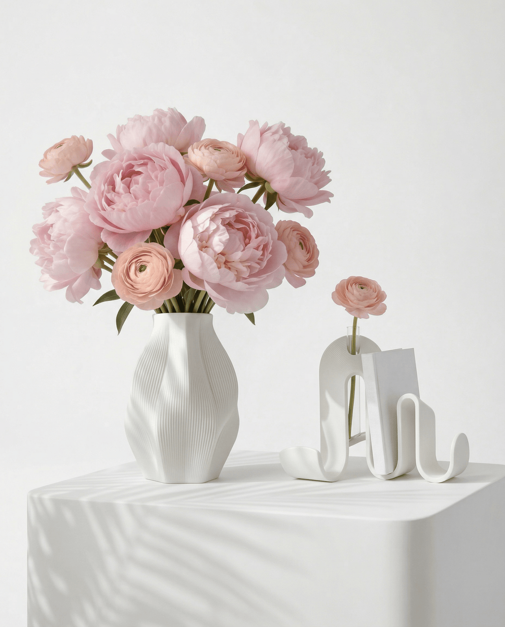 AMINI STRIA Living Set in White — vase and book holder on a draped white table with pink peonies