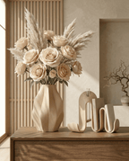 AMINI STRIA Living Set in Cream — vase with champagne roses and pampas grass beside book holder on a wooden sideboard