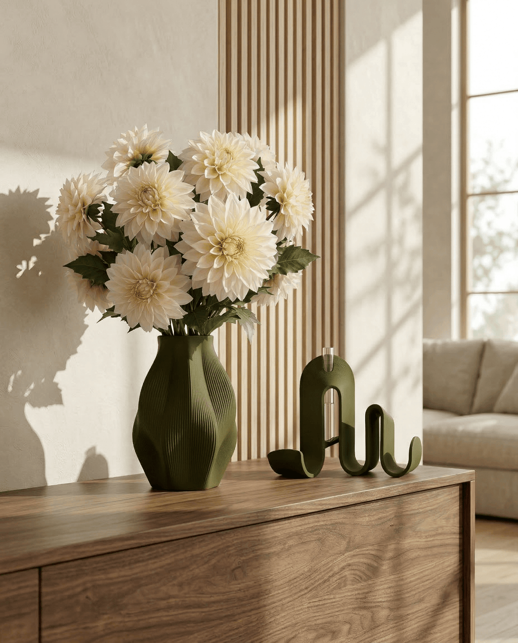 AMINI STRIA Living Set in Olive — vase with cream dahlias beside book holder on a dark walnut sideboard with wood slat wall