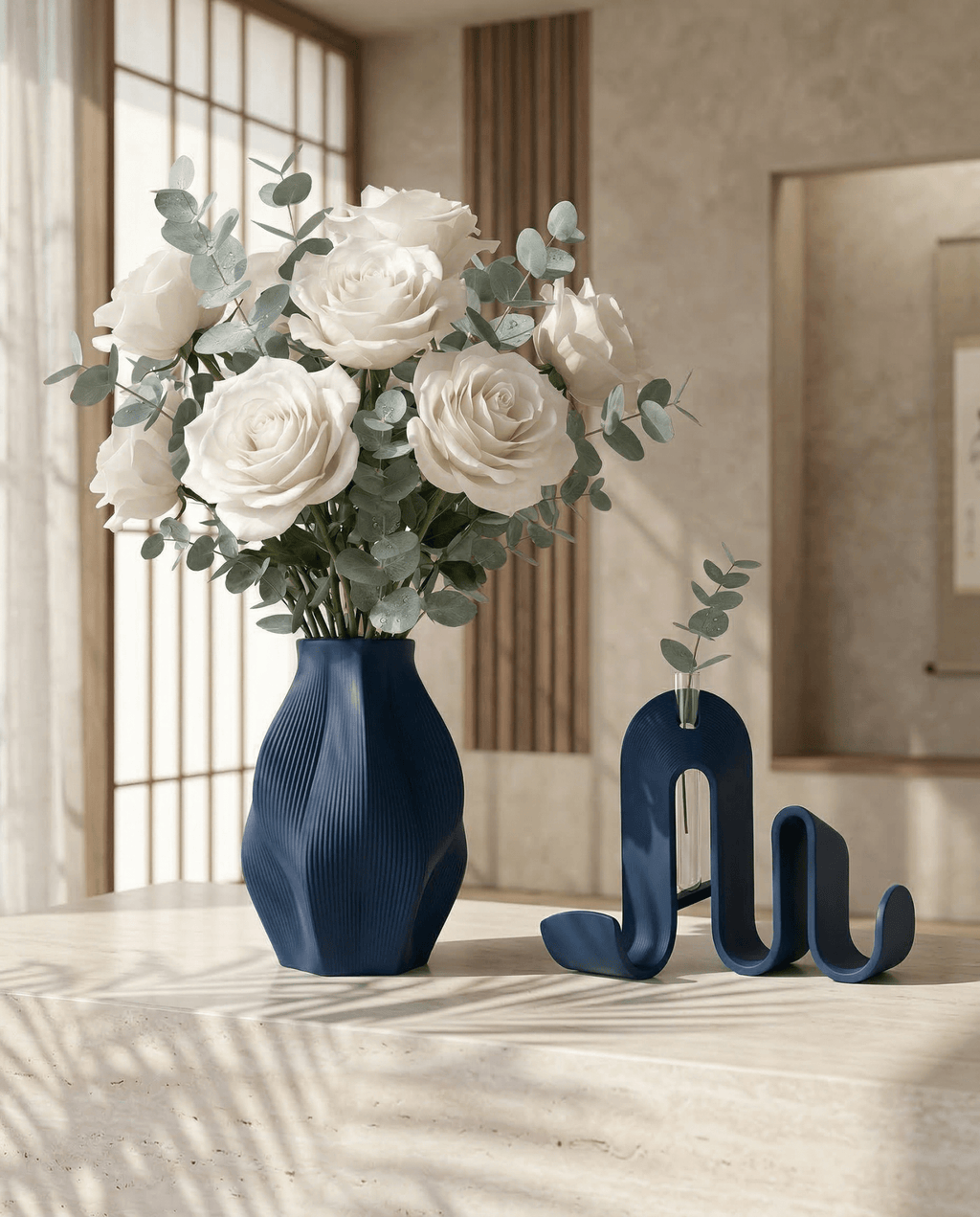 AMINI STRIA Living Set in Navy — vase with white roses and eucalyptus beside book holder on a travertine surface in a Japanese-style interior