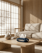 AMINI STRIA Tissue Holder in Navy — on a low oak coffee table in a Japanese room with iron teapot and wood slat wall