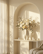 AMINI STRIA Vase in White — with white and cream roses in a sunlit arched niche, leaf shadows on wall